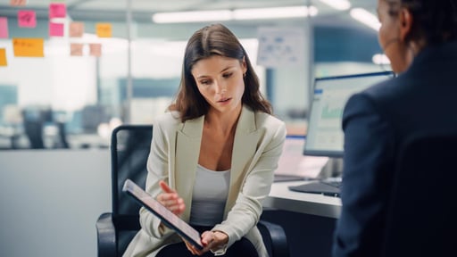 female-european-adult-business-office-showing-result-on-tablet-print